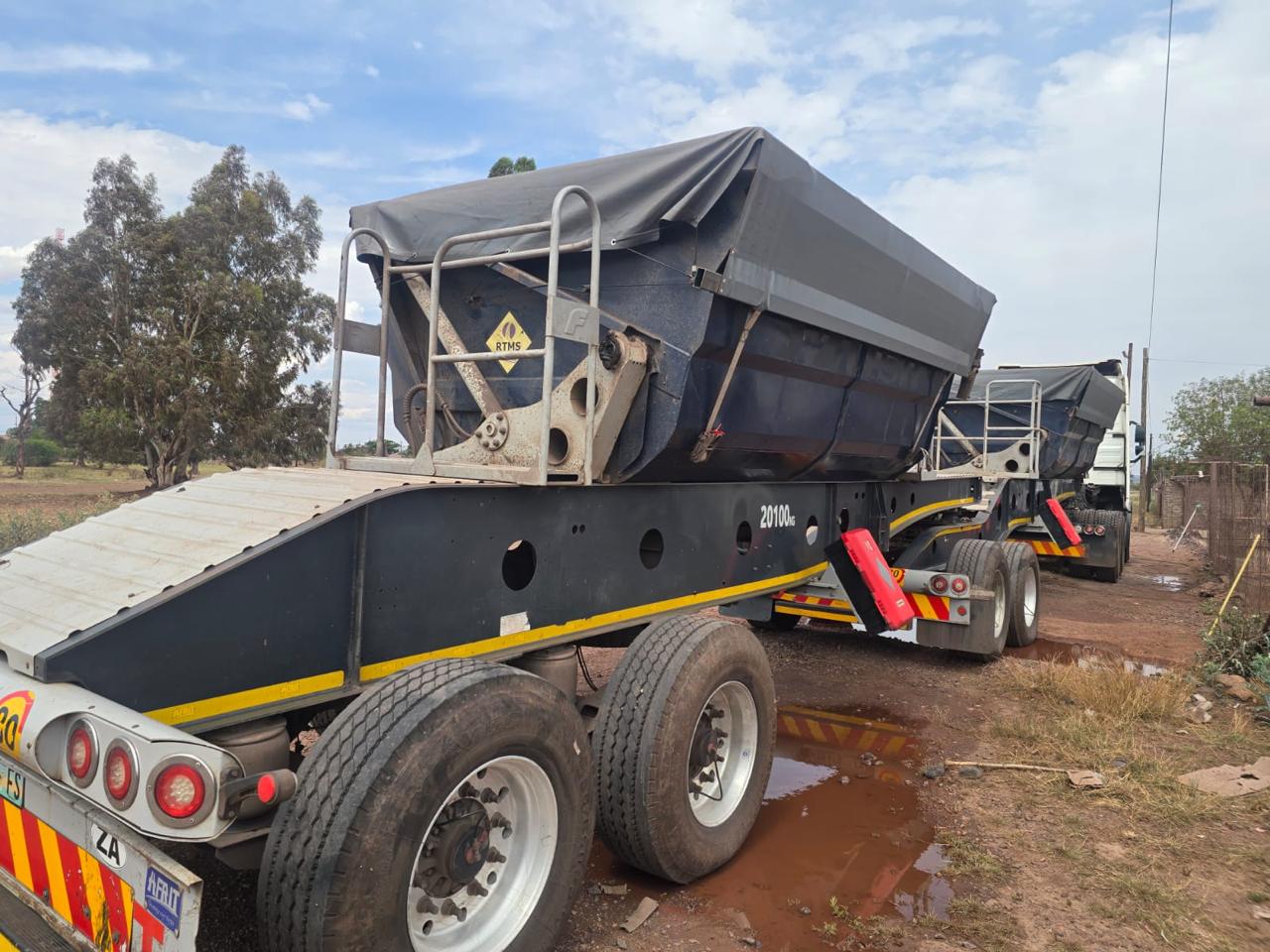 Heavy truck and trailer showing multiple fitted tyres