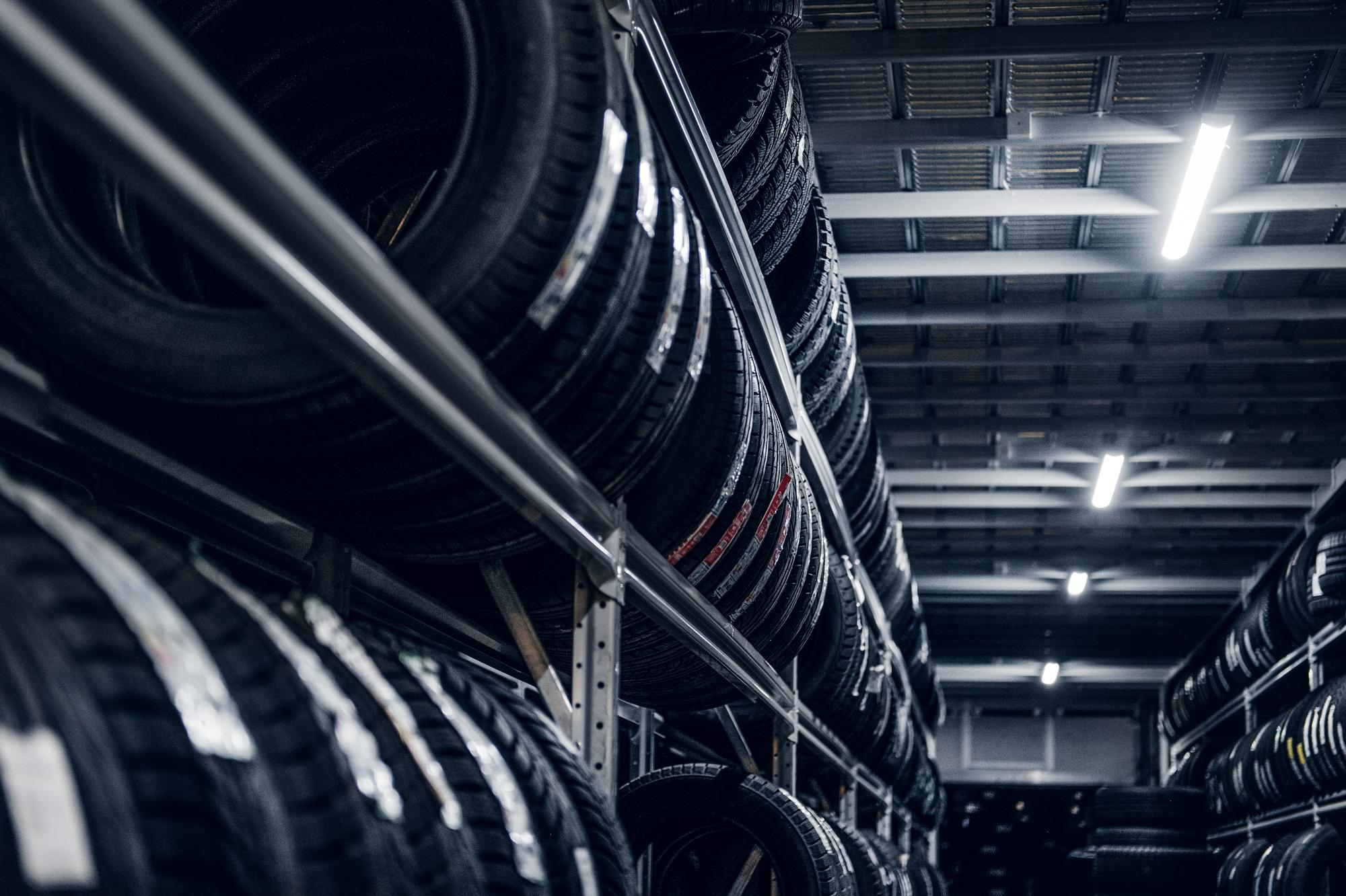 Rows of tyres ready for fitting in a professional workshop